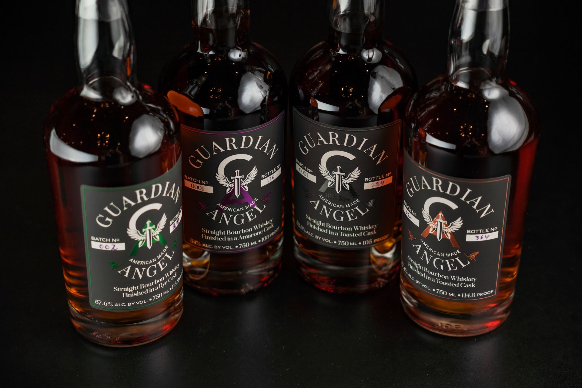 Four bourbon bottles lined up